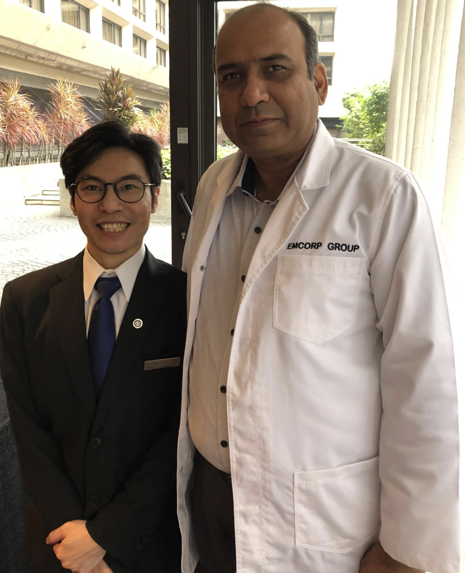 Emcorp auditor with a hotel staff member