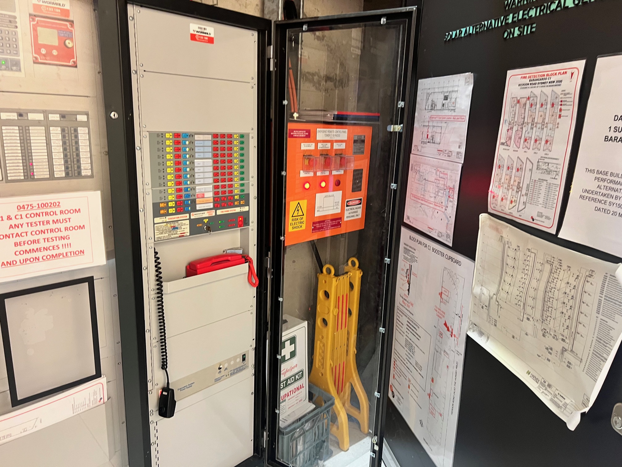 Fire indicator panel and emergency plans in a building control room